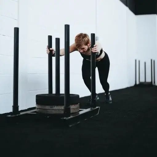 Woman pushing sled at FIT4CHANGE